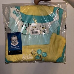 3-6 months Gerber baby girl 4pack of Onesies. Never worn or opened, brand new